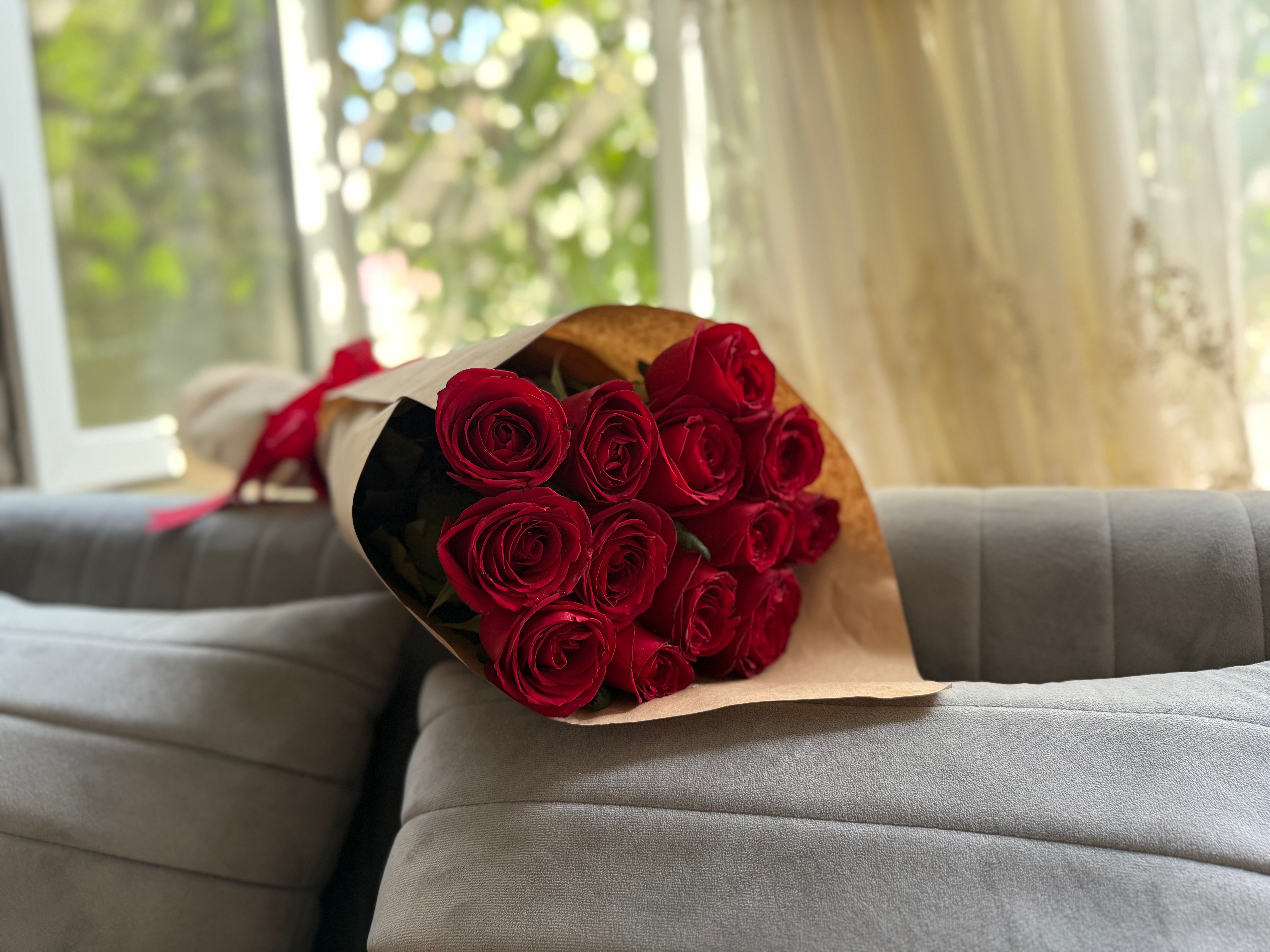 Classic rose bouquet wrapped in paper ready for delivery in Germany