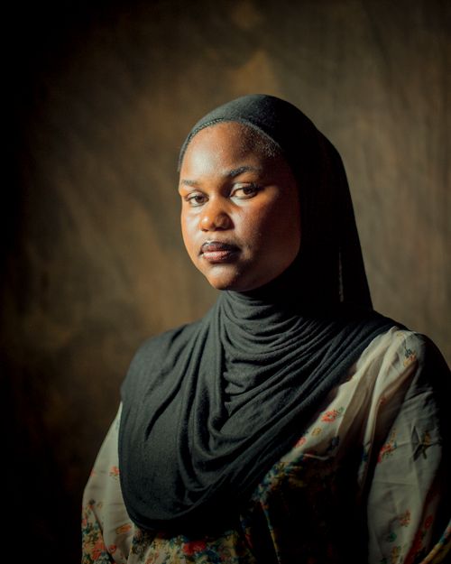 Free Elegant portrait of a woman in a black hijab with a serene expression. Stock Photo
