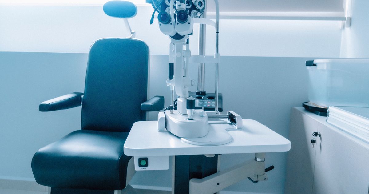 Modern optometry examination room with ophthalmic equipment