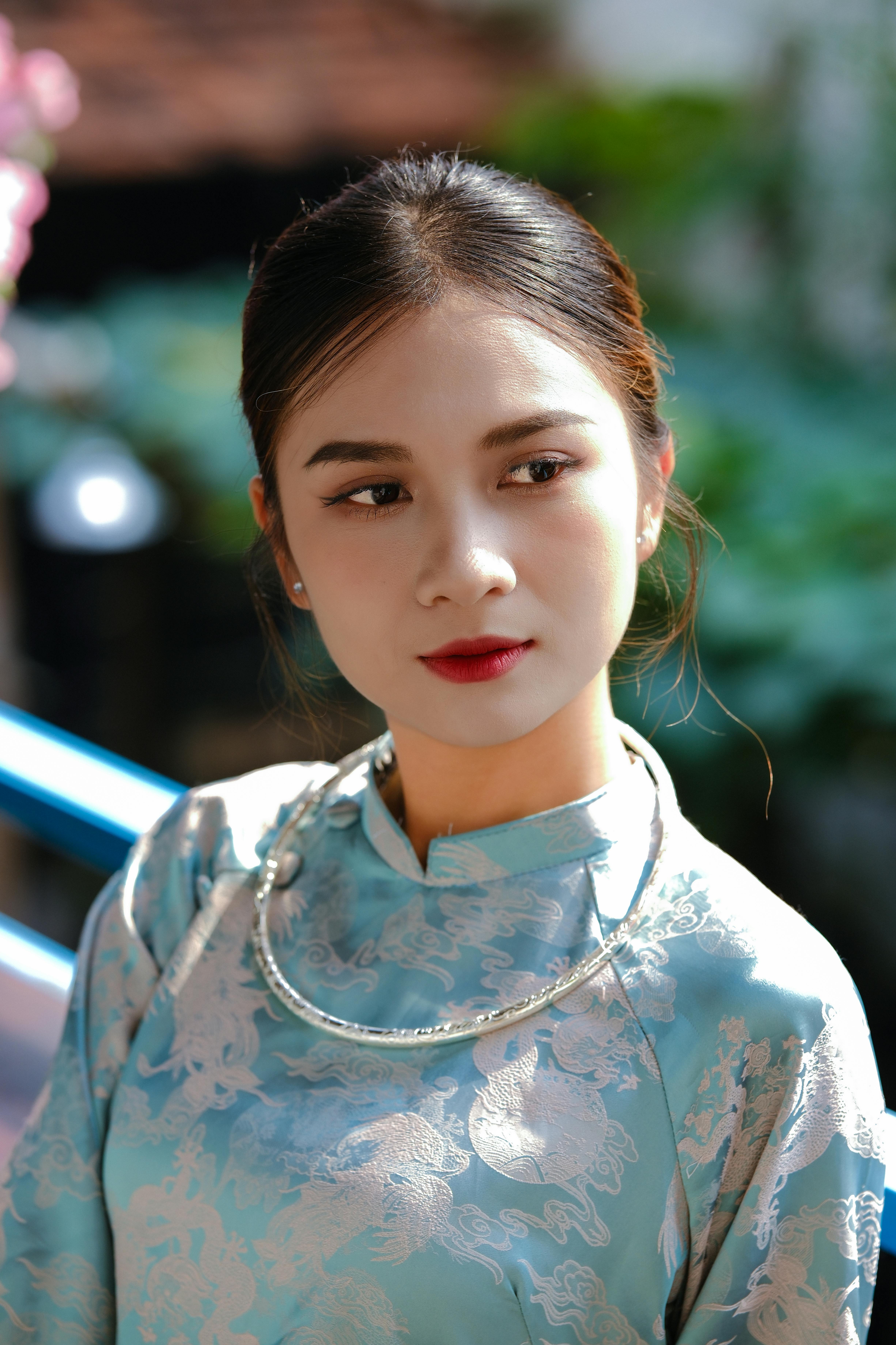 Elegant portrait of a woman in traditional attire with serene expression.