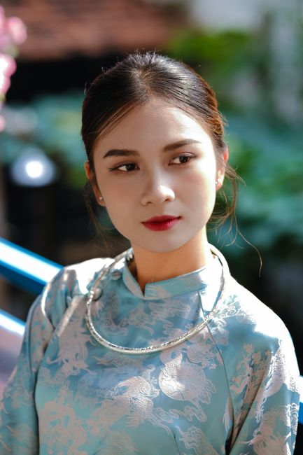 Elegant portrait of a woman in traditional attire with serene expression.