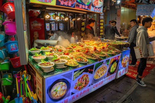 Vibrant night market scene in Xiamen showcasing diverse street food offerings and local culture.