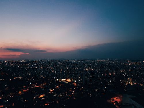 Free Stunning view of Belo Horizonte skyline at dusk with vibrant city lights and a colorful sky. Stock Photo