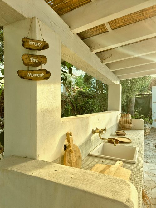 Free Outdoor kitchen with wooden decor and a serene vibe, featuring rustic elements. Stock Photo
