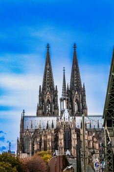 Captivating image of Cologne Cathedral, an iconic landmark in Köln, Germany, against a vibrant sky.