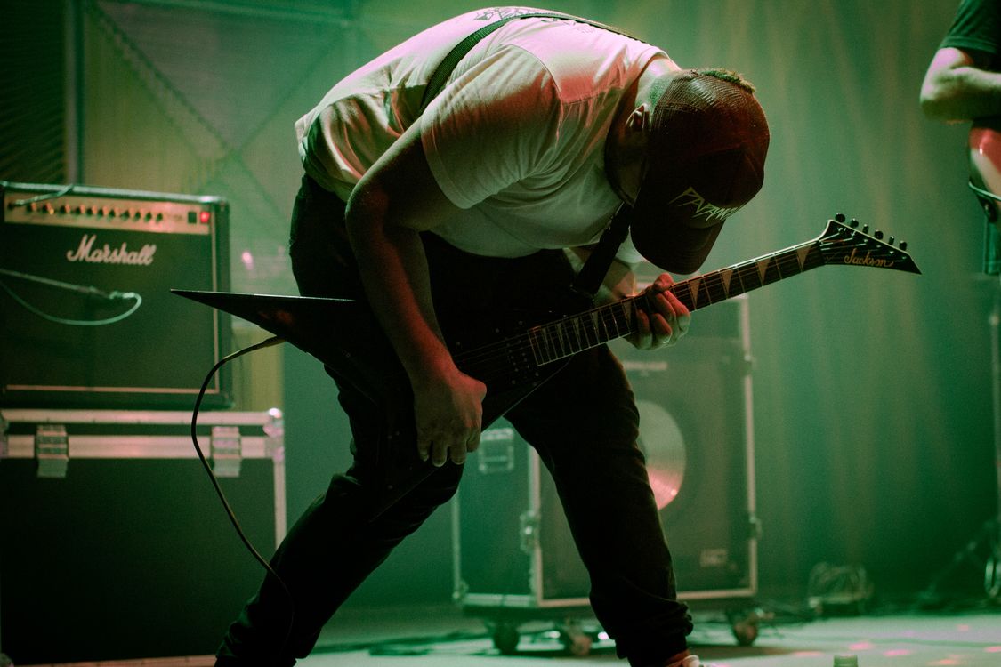 Guitar Rocker Rock Guitarist Performing Energetic Live Concert · Free Stock Photo