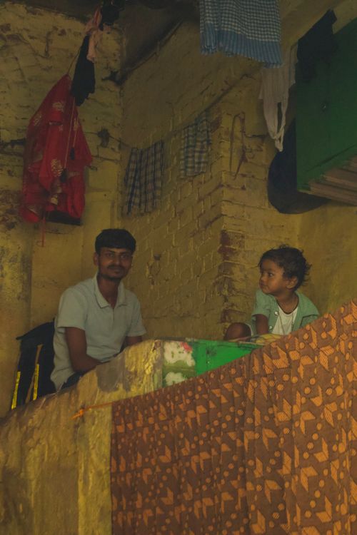 Free A warm candid portrait of a man and child sitting indoors. Stock Photo