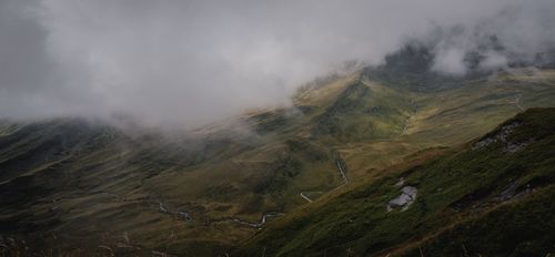 Free Dramatic view of misty mountains in Grindelwald, Switzerland, showcasing natural beauty and mystery. Stock Photo