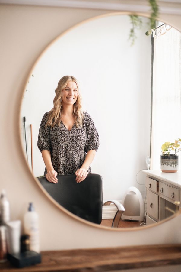 Business owner standing in her studio, photo by Daniel & Hannah Snipes on Pexels