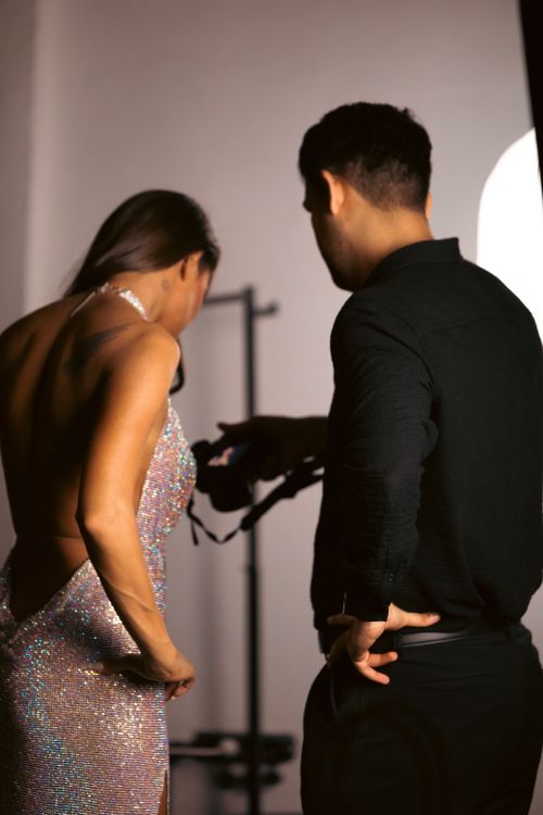 Free Backstage glimpse of fashion photographer and model. Stock Photo