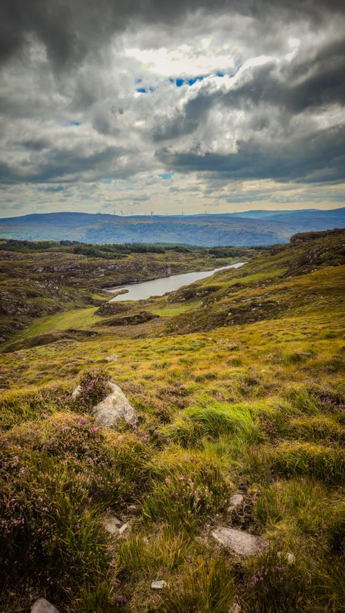 Free Explore breathtaking rolling hills and dramatic skies in Крохейн, Ireland's countryside. Stock Photo