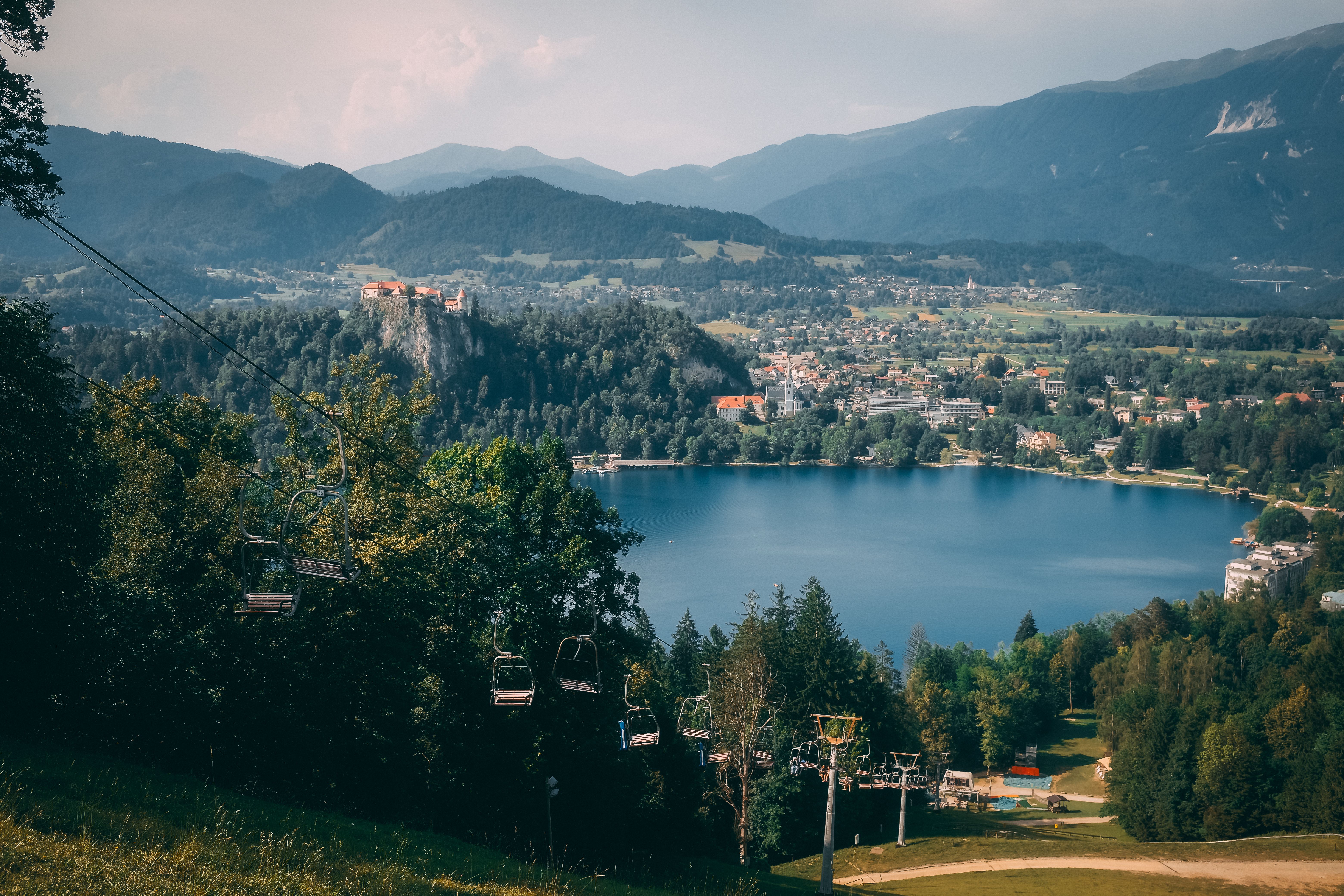 A breathtaking view of Lake Bled with chairlifts and mountains in Radovljica, Slovenia.
