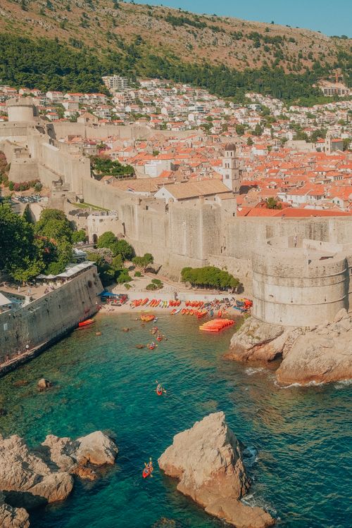 Free Stunning aerial view of Dubrovnik's medieval city walls and rocky coastline in Croatia. Stock Photo