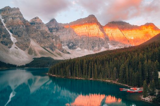 Golden sunrise illuminates Moraine Lake and Valley of the Ten Peaks in Banff National Park.