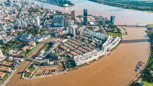 Free Discover the dynamic skyline and riverside of Phnom Penh from above, showcasing architecture and river scenery. Stock Photo