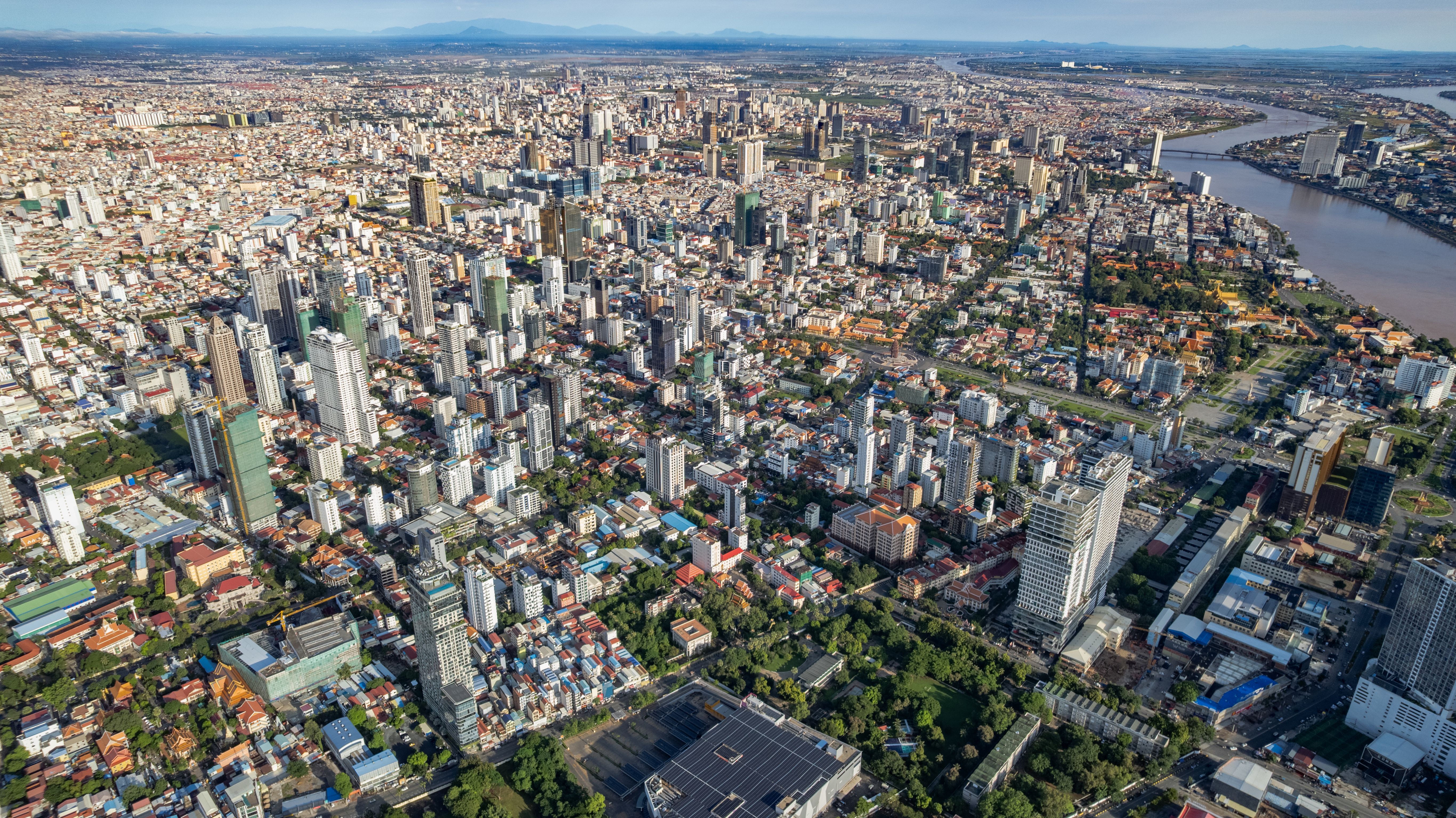 Stunning aerial view of Phnom Penh, Cambodia, showcasing its vibrant cityscape and river.