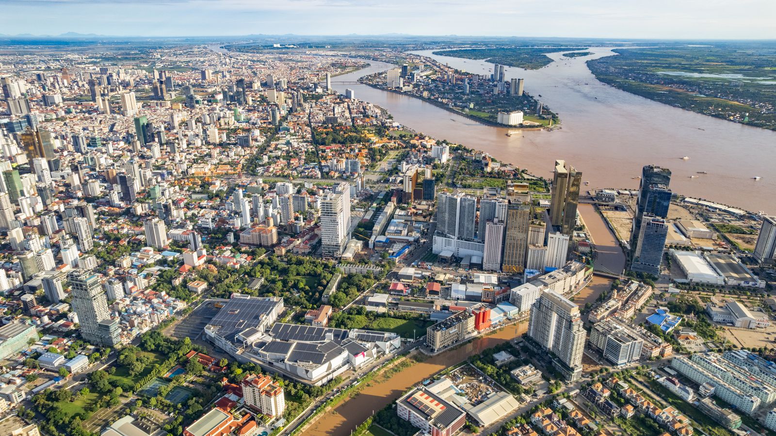 Aerial view of Phnom Penh's skyline beside the city's broad rivers