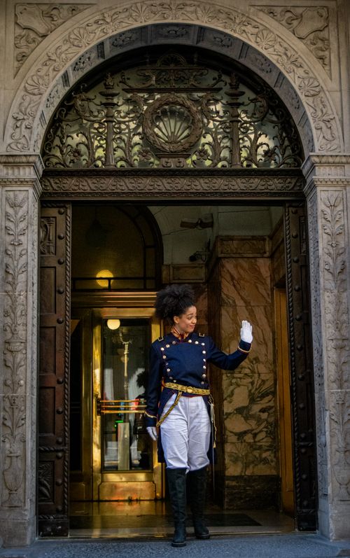 Free A guard in historical uniform stands at an ornate entrance in Buenos Aires, Argentina. Stock Photo
