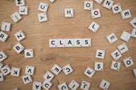 Scrabble Tiles Spelling 'Class' on Wooden Background