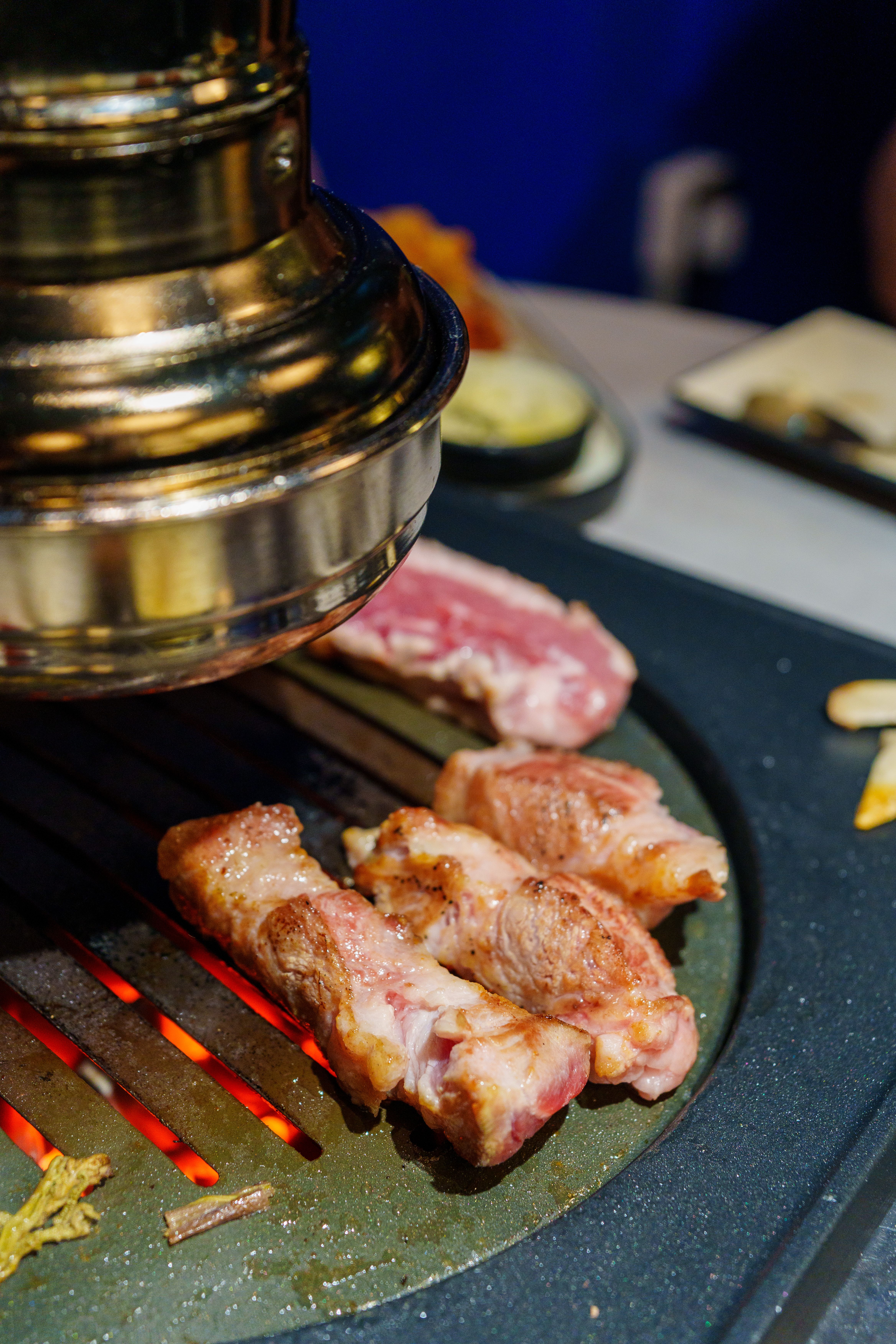 Close-up of Meat Grilling on Korean BBQ Grill · Free Stock Photo