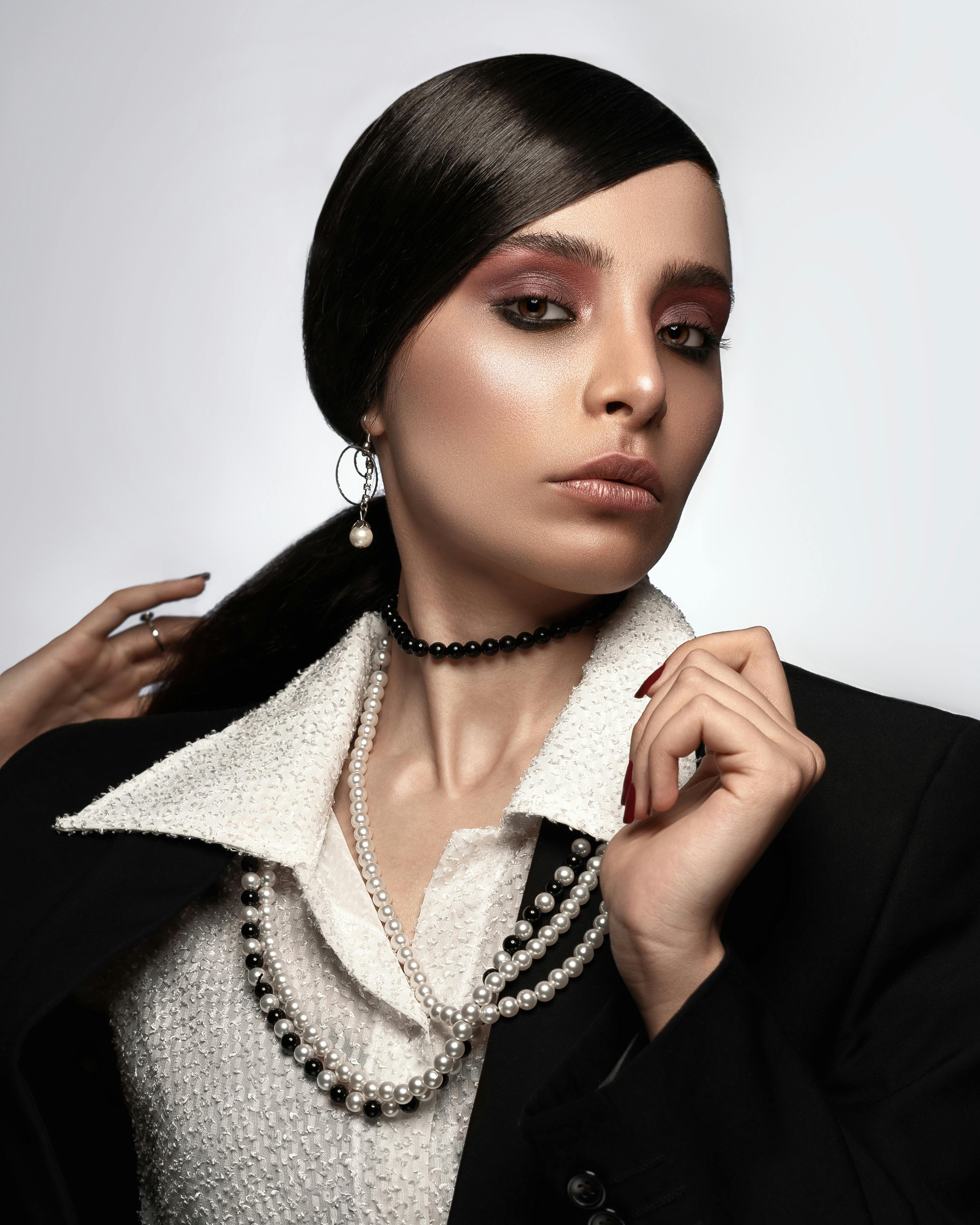 woman wearing pearl necklace