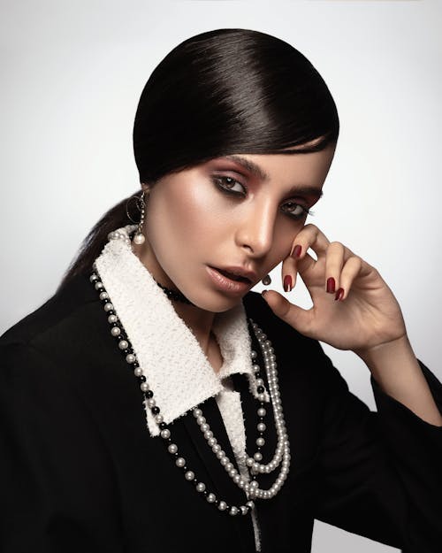 Woman Wearing Black and White Long-sleeved Collared Dress