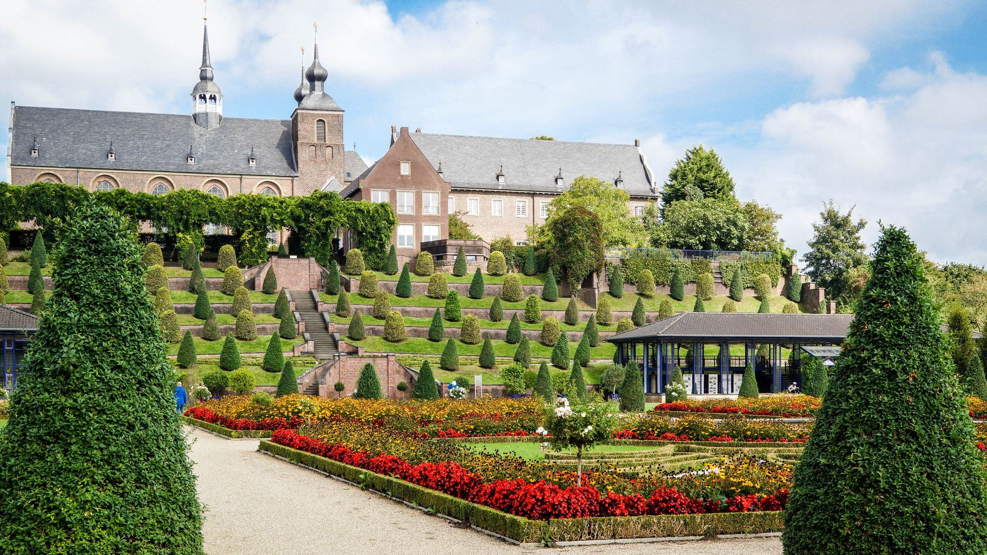 Vibrant terraced gardens with historical architecture in Kamp-Lintfort.