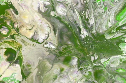 Free Vivid green and white marbled fluid art pattern with dynamic swirling effects. Stock Photo