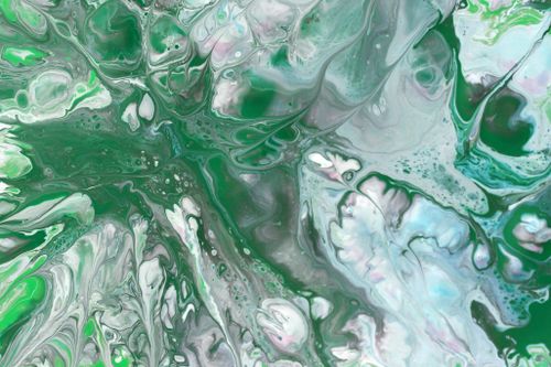 Free Captivating abstract art featuring swirling green, white, and grey hues, creating a fluid and dynamic visual experience. Stock Photo