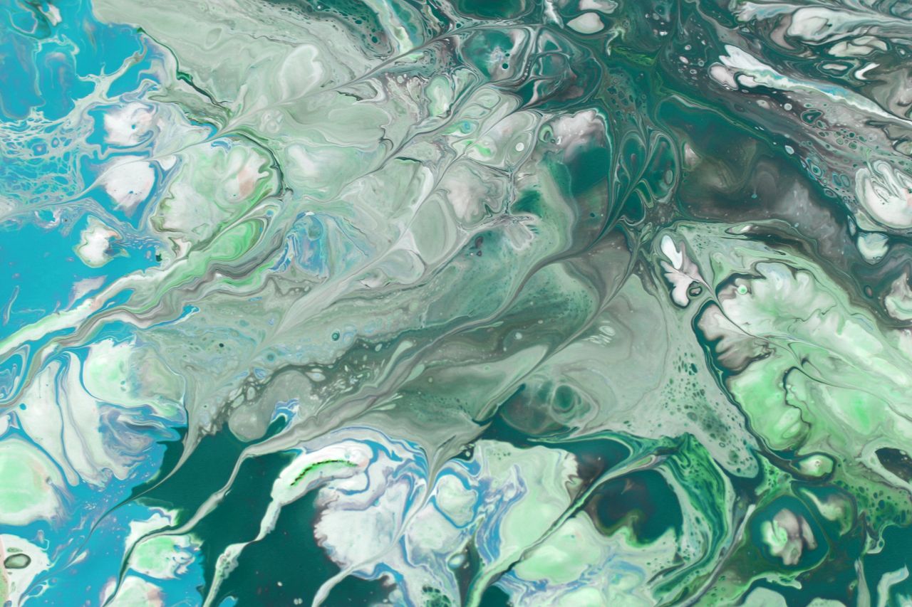vivid abstract fluid art with swirling green and blue patterns creatin