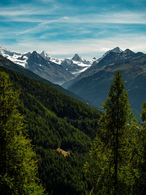 Free Breathtaking panorama of Anniviers Alps in Wallis, showcasing lush green forests and majestic peaks. Stock Photo