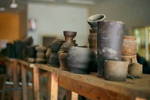 Studio shelf of stacked pots — Finalchoice on Pexels