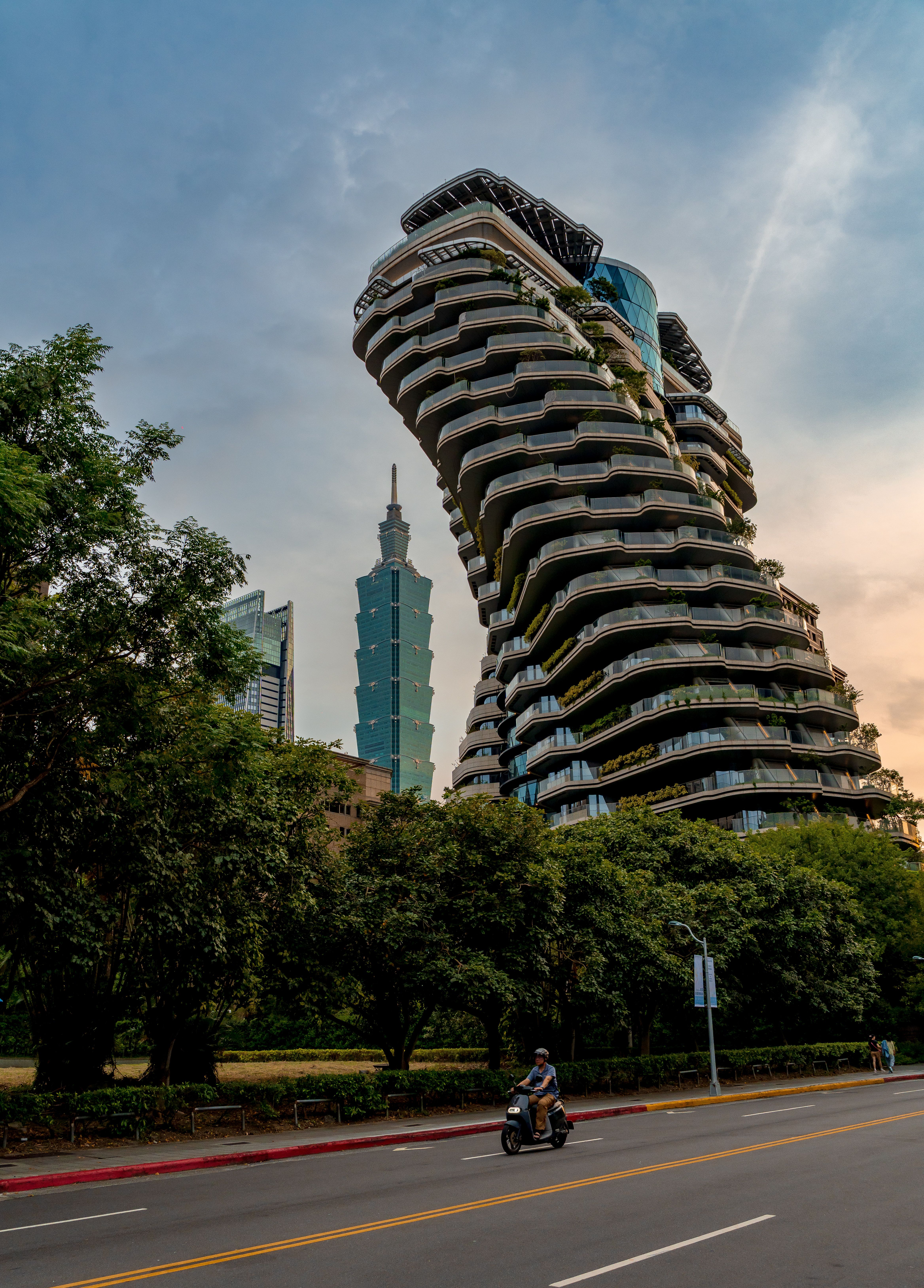 Modern architectural marvels intertwine with nature in Taipei's dynamic skyline.