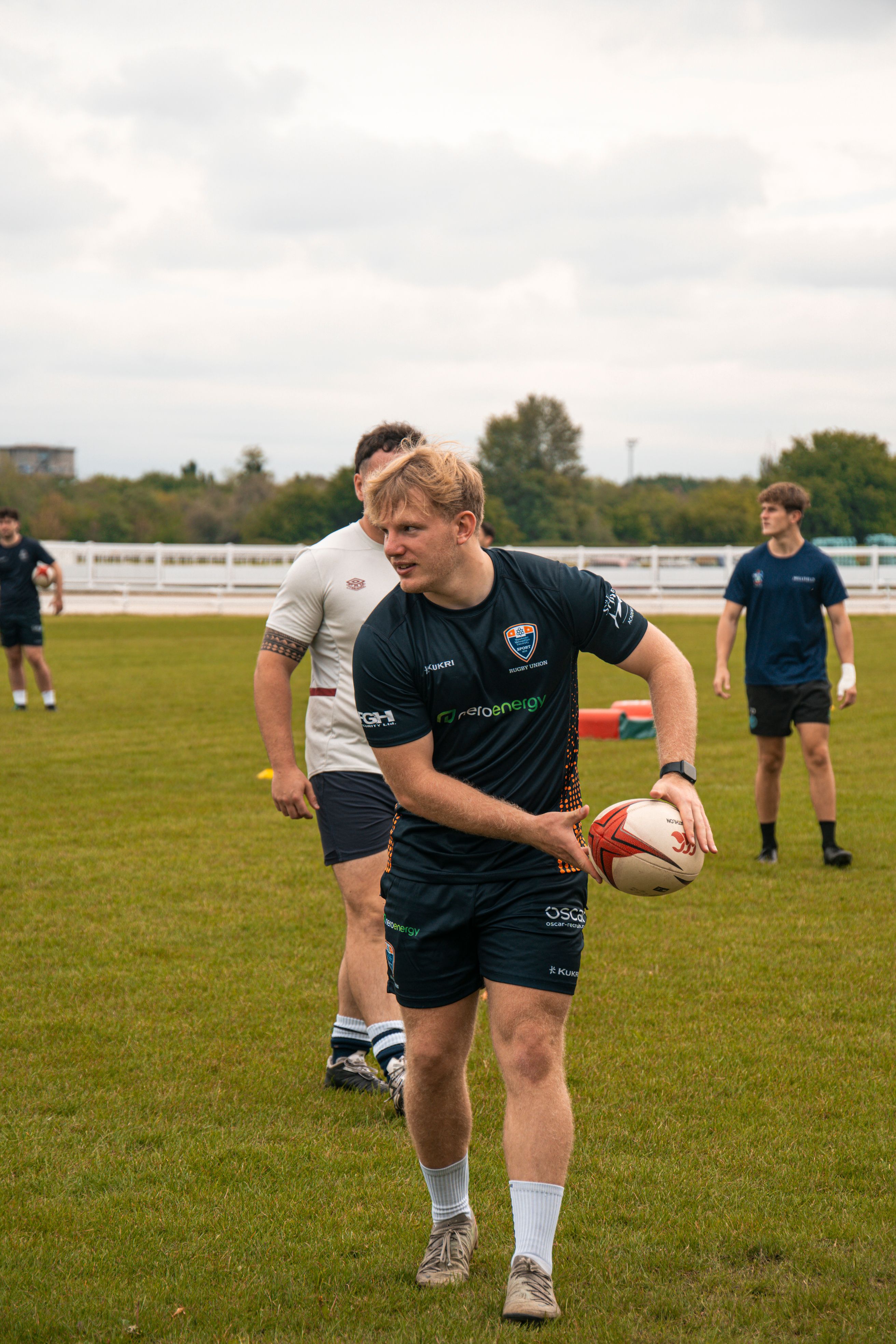 Young Men Playing Rugby on Sports Field · Free Stock Photo