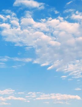 A serene image of a bright blue sky filled with fluffy white clouds, perfect for nature and peaceful themes.