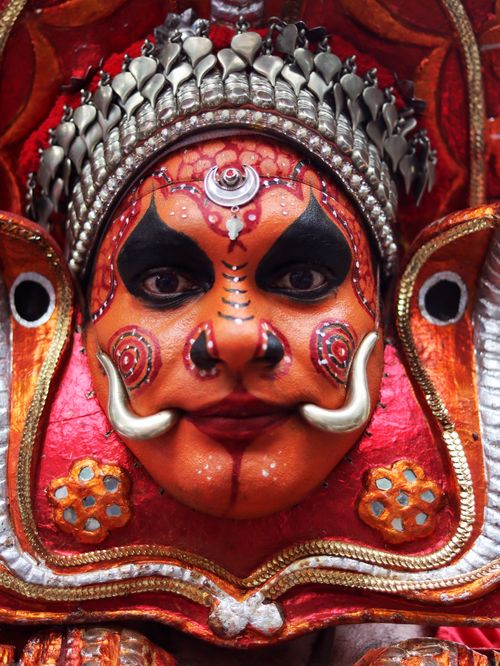 Free Close-up of a Kathakali dancer in traditional attire and vivid face paint. Stock Photo