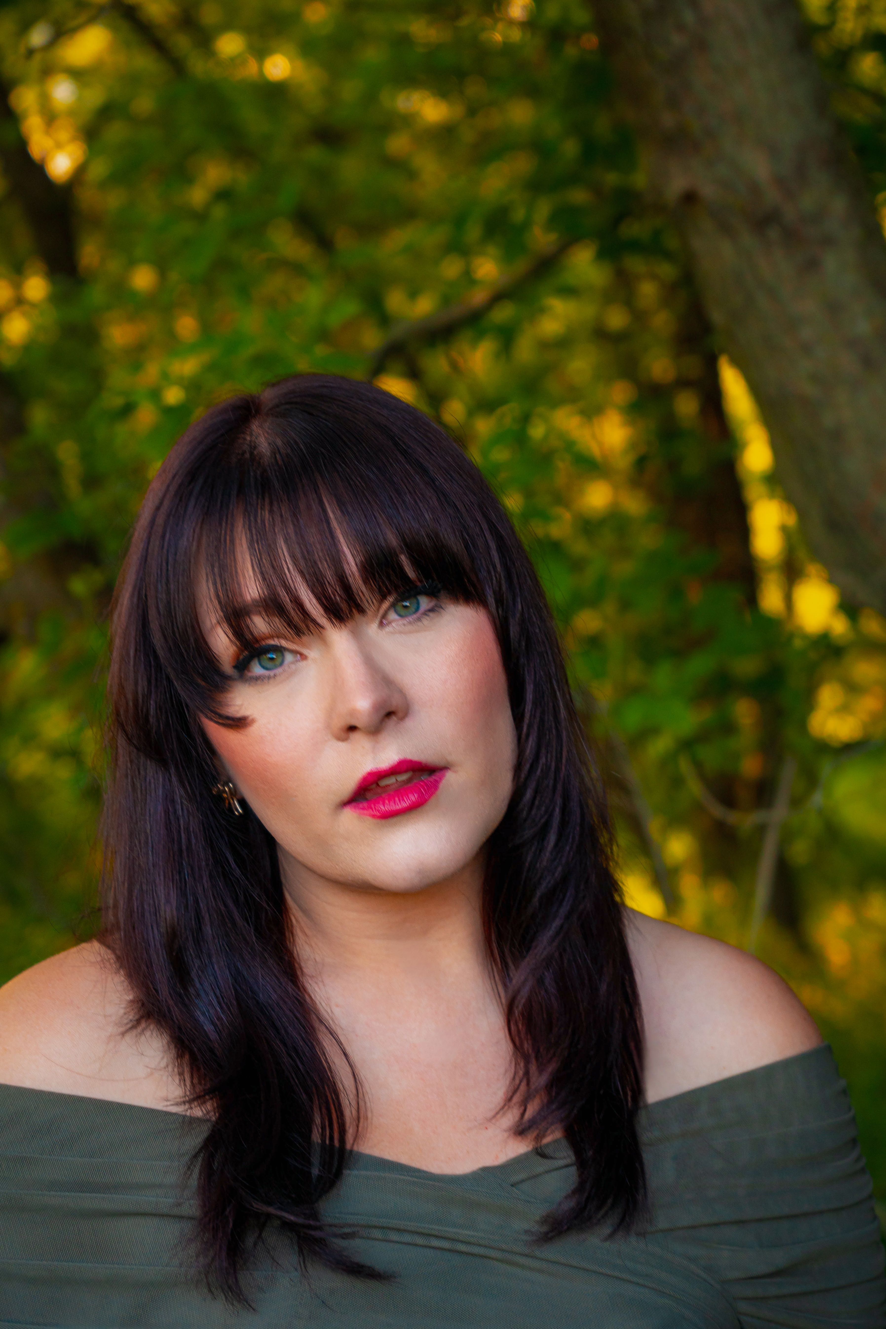 Elegant portrait of a woman in fall colors, captured during golden hour.