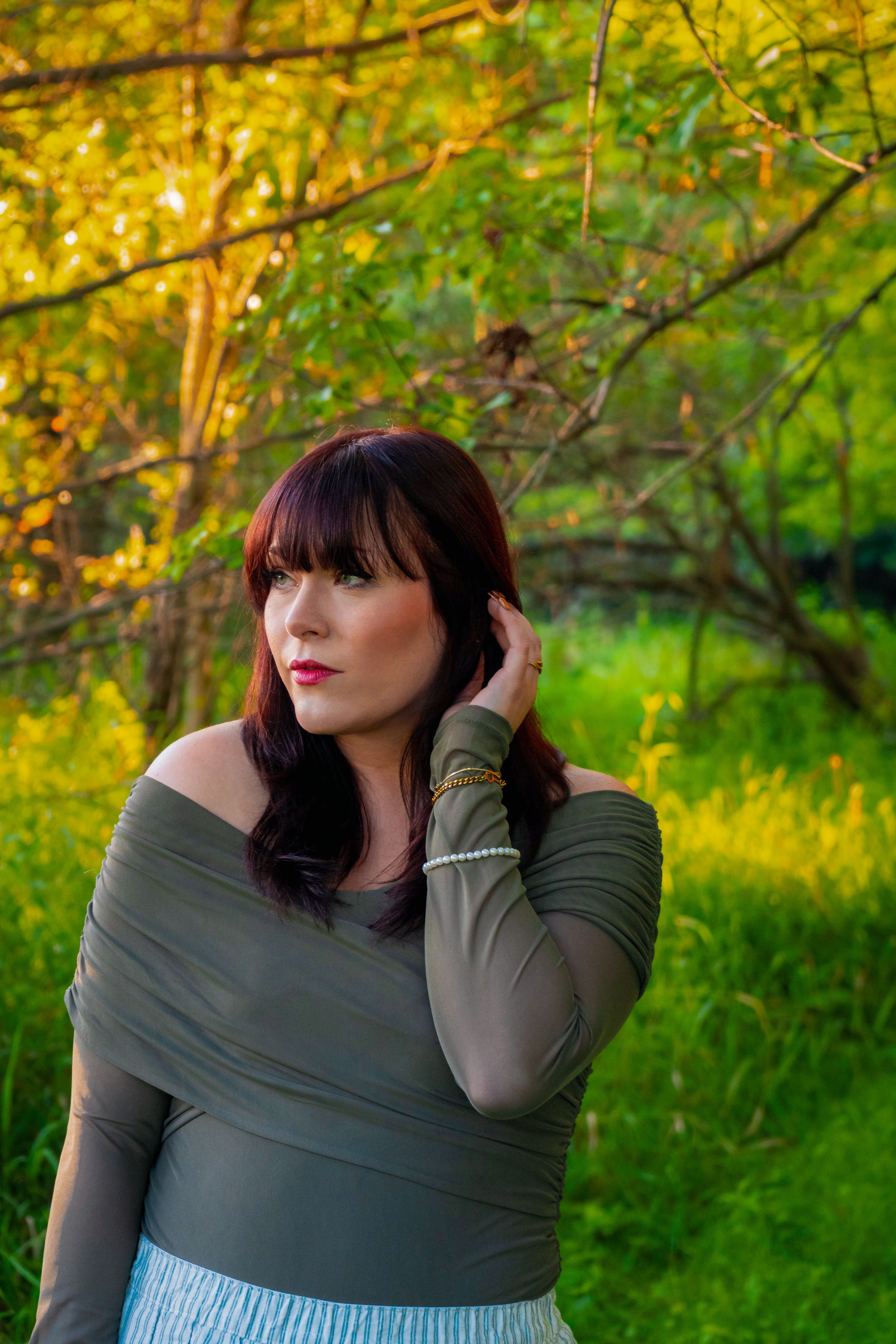 Elegant Woman Posing in Fall Forest Setting · Free Stock Photo