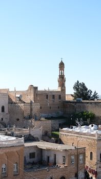 A scenic view of historic stone architecture in Midyat, Mardin, showcasing its cultural heritage.