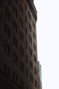 Dramatic architectural contrast showcasing New York City buildings against the sky.