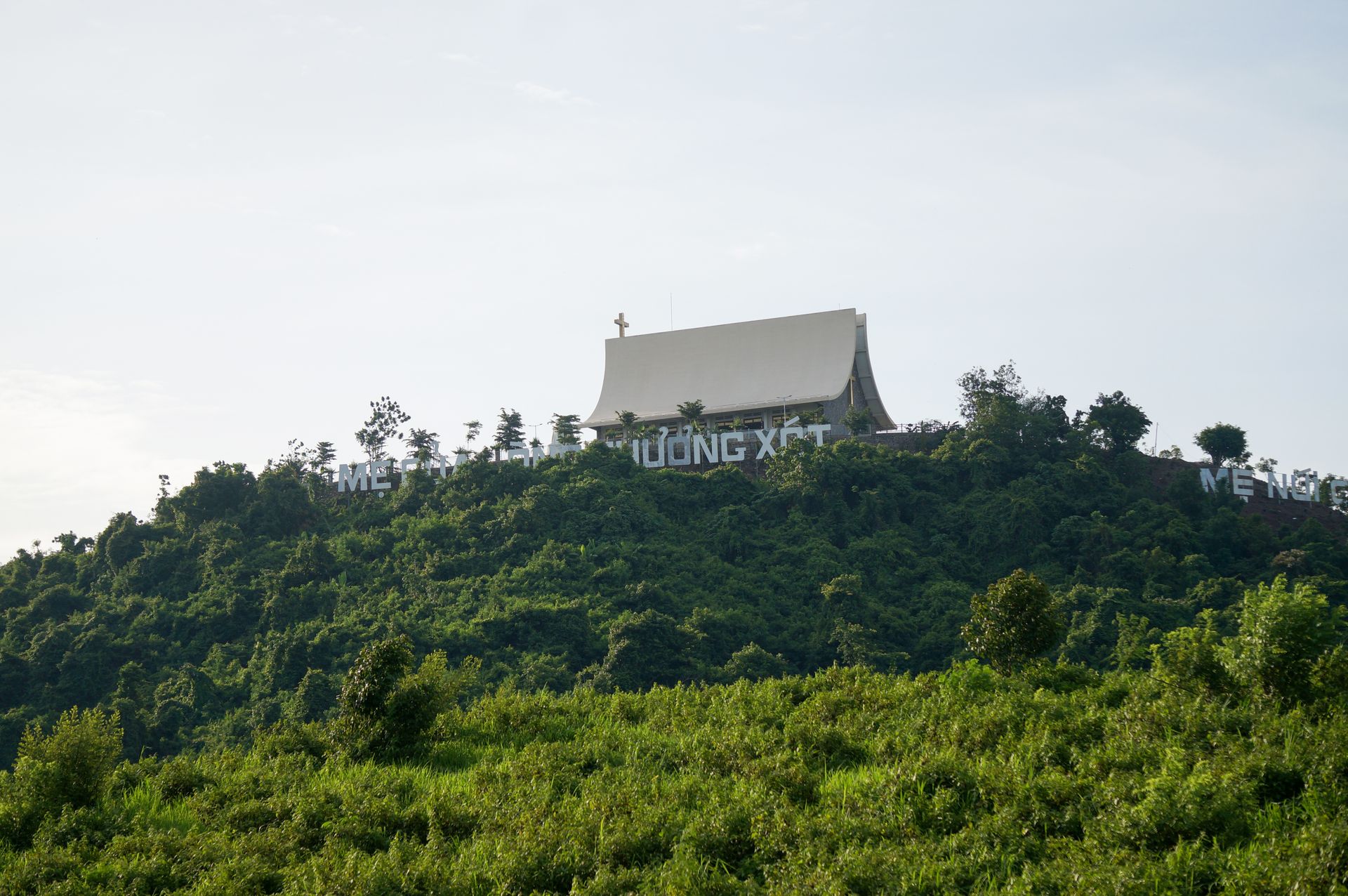 Chapel of Mercy on Nui Cui Mountain View from Below at Sunset, Vietnam | Catholic Pilgrimage Site Landscape