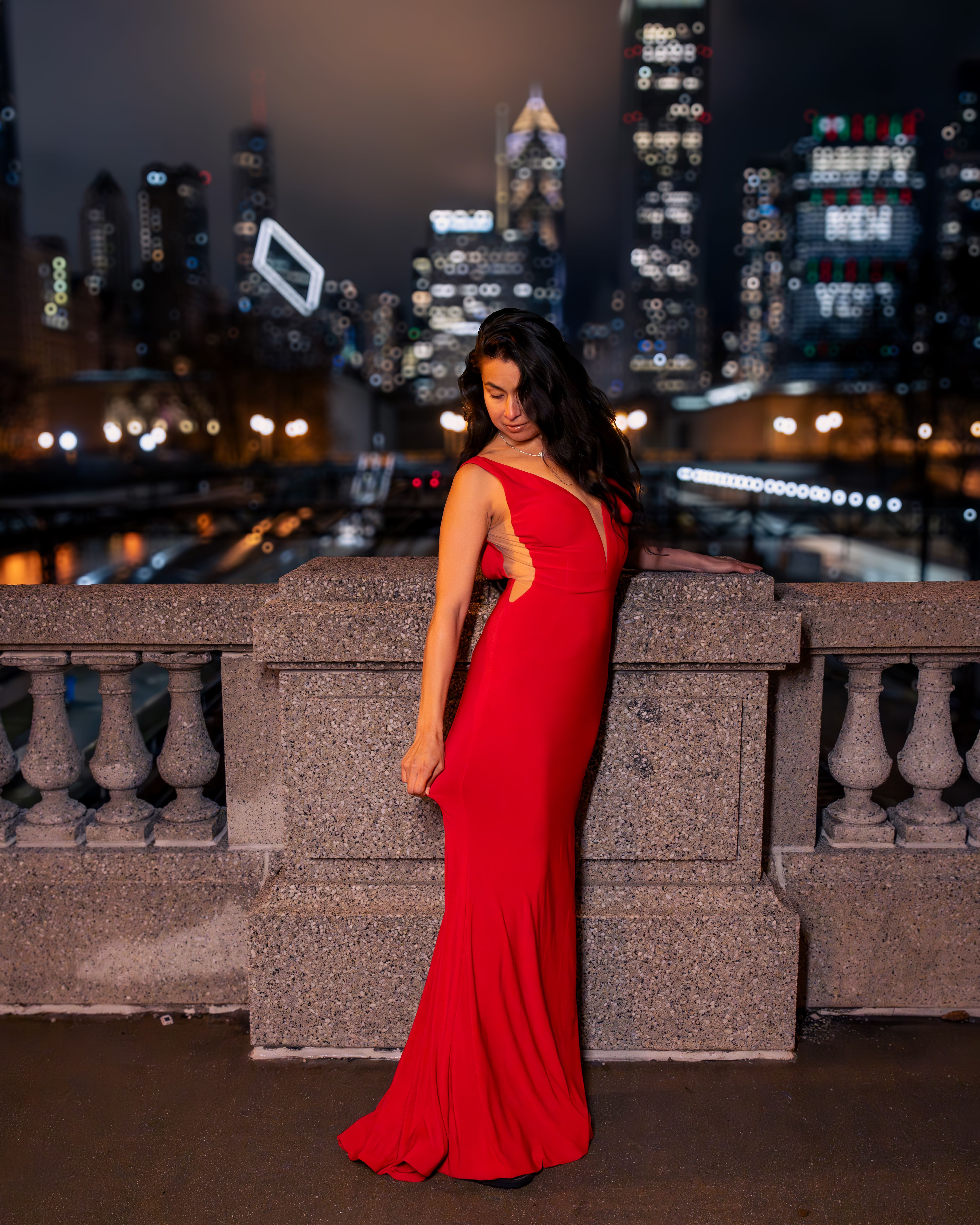 Elegant Woman in Red Dress Posing with Chicago Skyline · Free Stock Photo