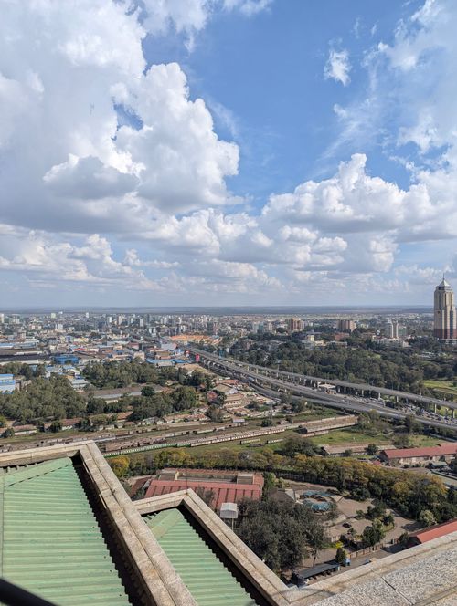 Free Aerial view of Nairobi skyline with clouds and cityscape, showcasing urban beauty. Stock Photo