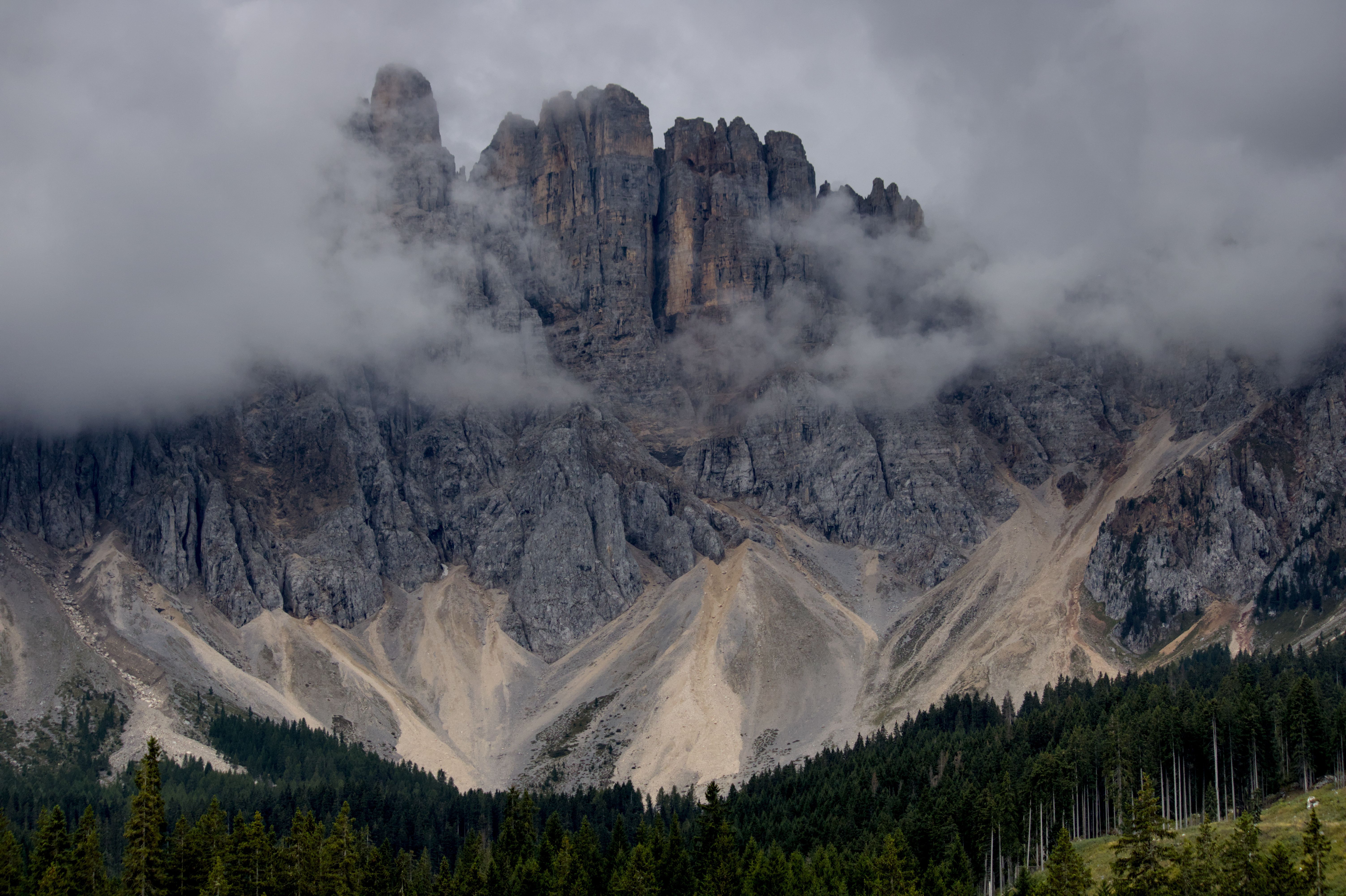 Dramatic Mountain Peaks Shrouded in Clouds · Free Stock Photo