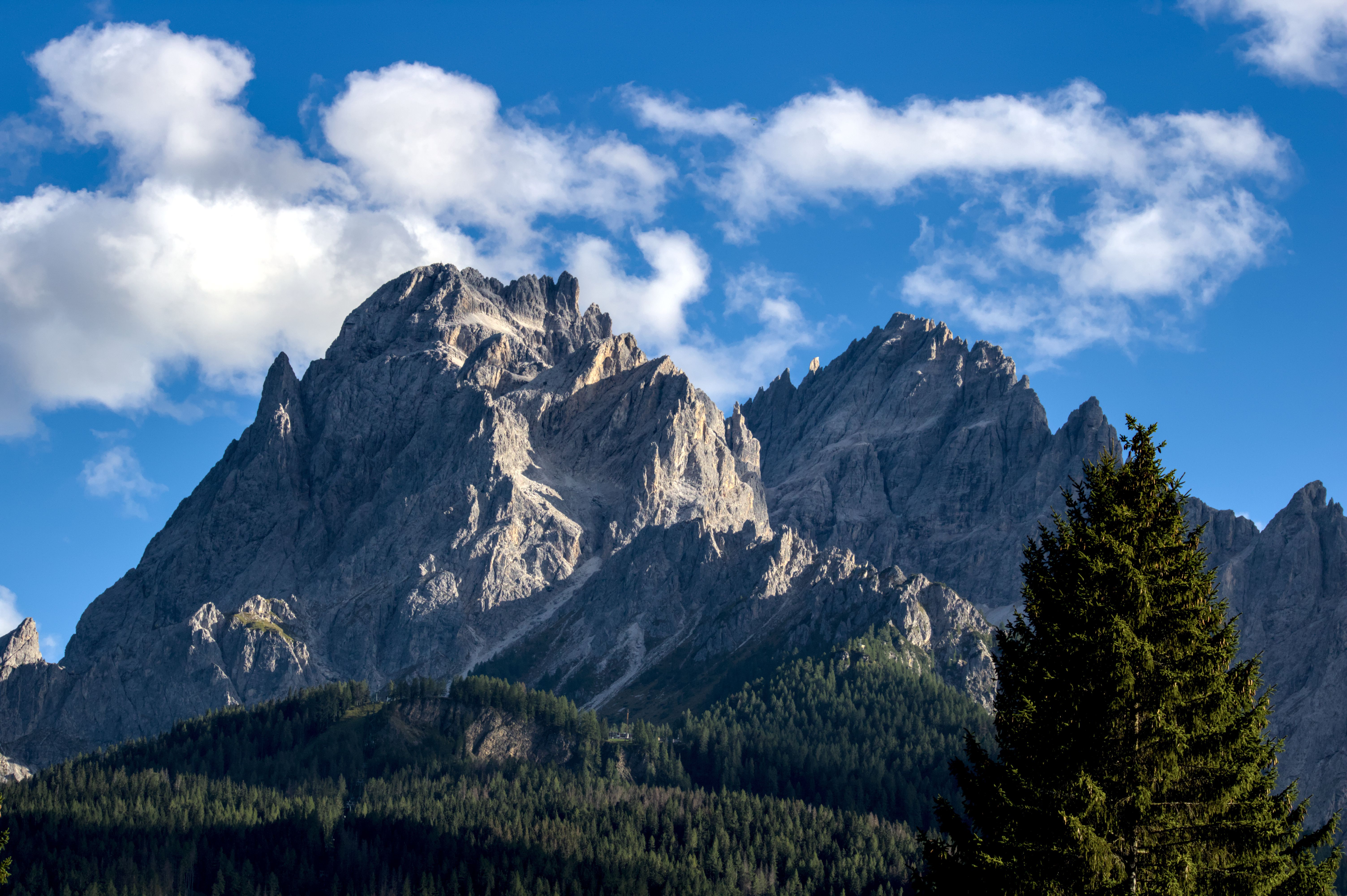 Majestic Mountain Peaks Under Blue Sky · Free Stock Photo