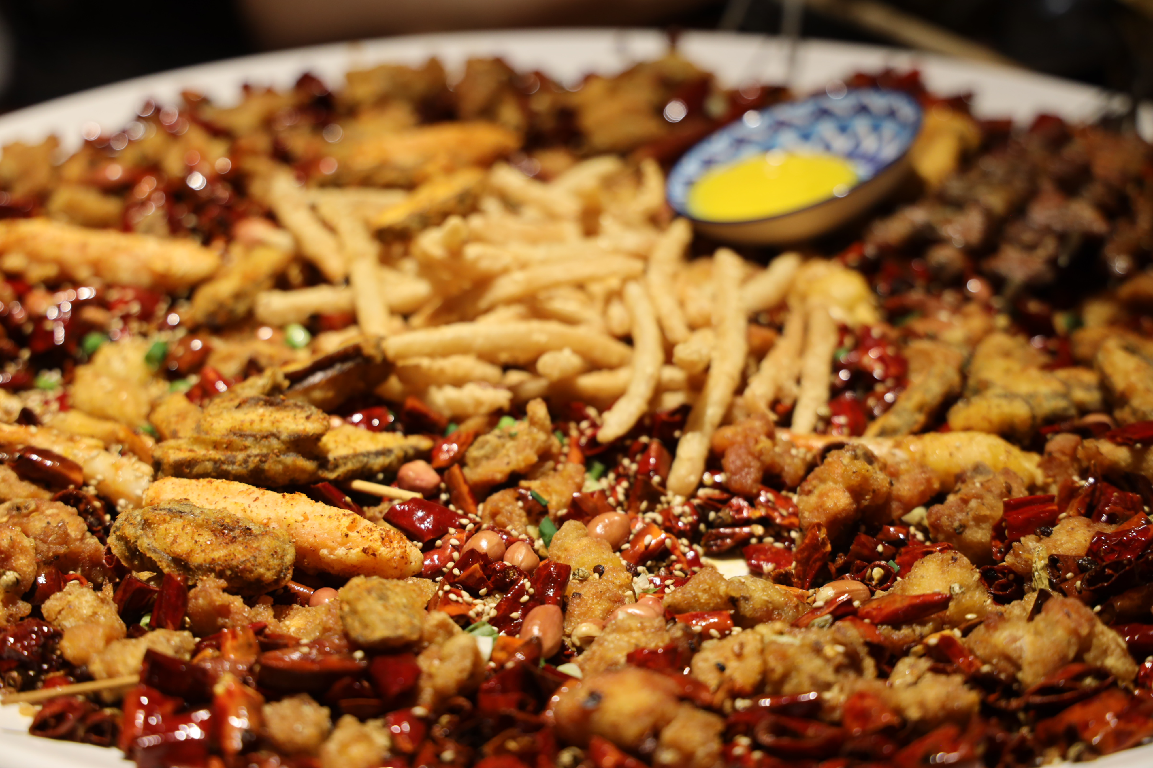 Fresh ingredients like dried chili flakes, garlic, and oil used in making chili crisp