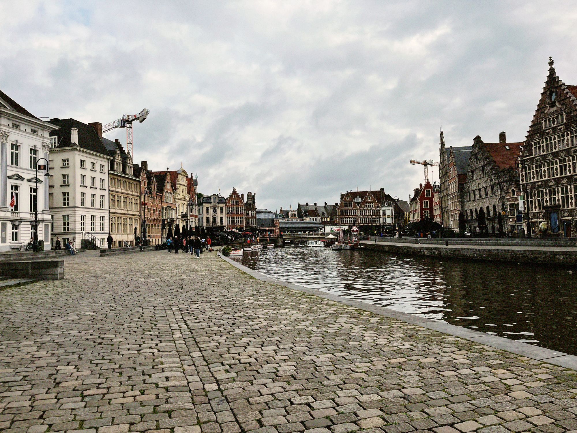 Explore Ghent, Belgium with its stunning medieval architecture and serene canal scene.