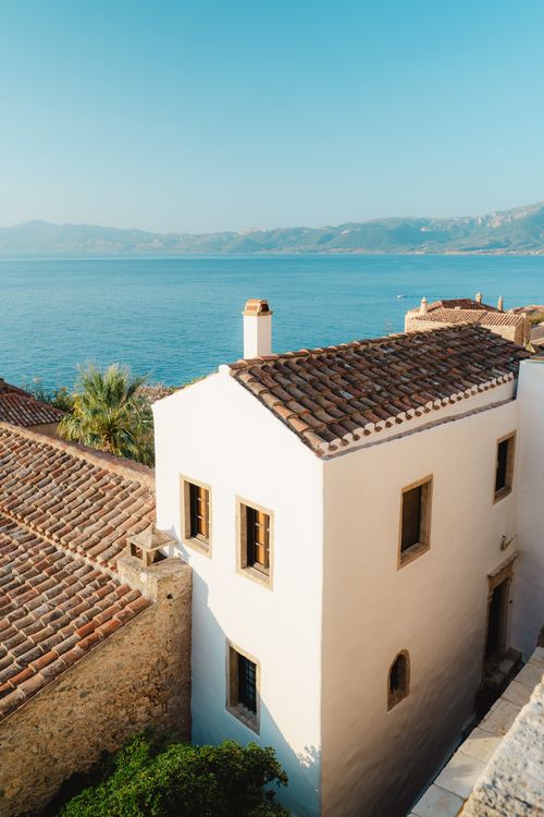 Free Discover the enchanting coastal architecture of Monemvasia, Greece, bathed in morning light. Stock Photo