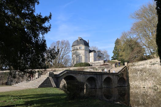 Charming historic scene of a bridge and classical building in Châteauneuf-sur-Loire, France.