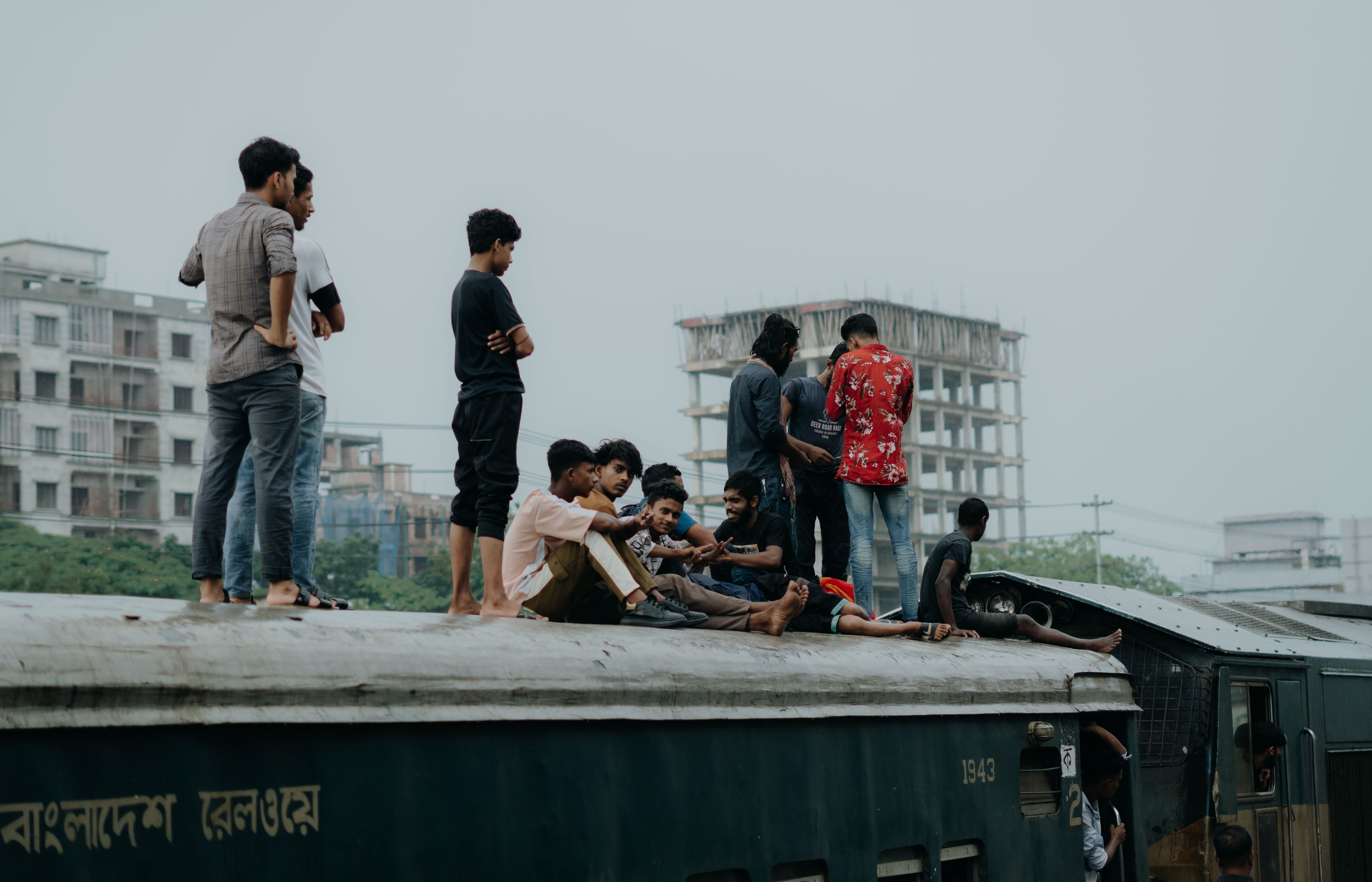 Overcrowded urban slum in Dhaka, Bangladesh, with people and temporary shelters